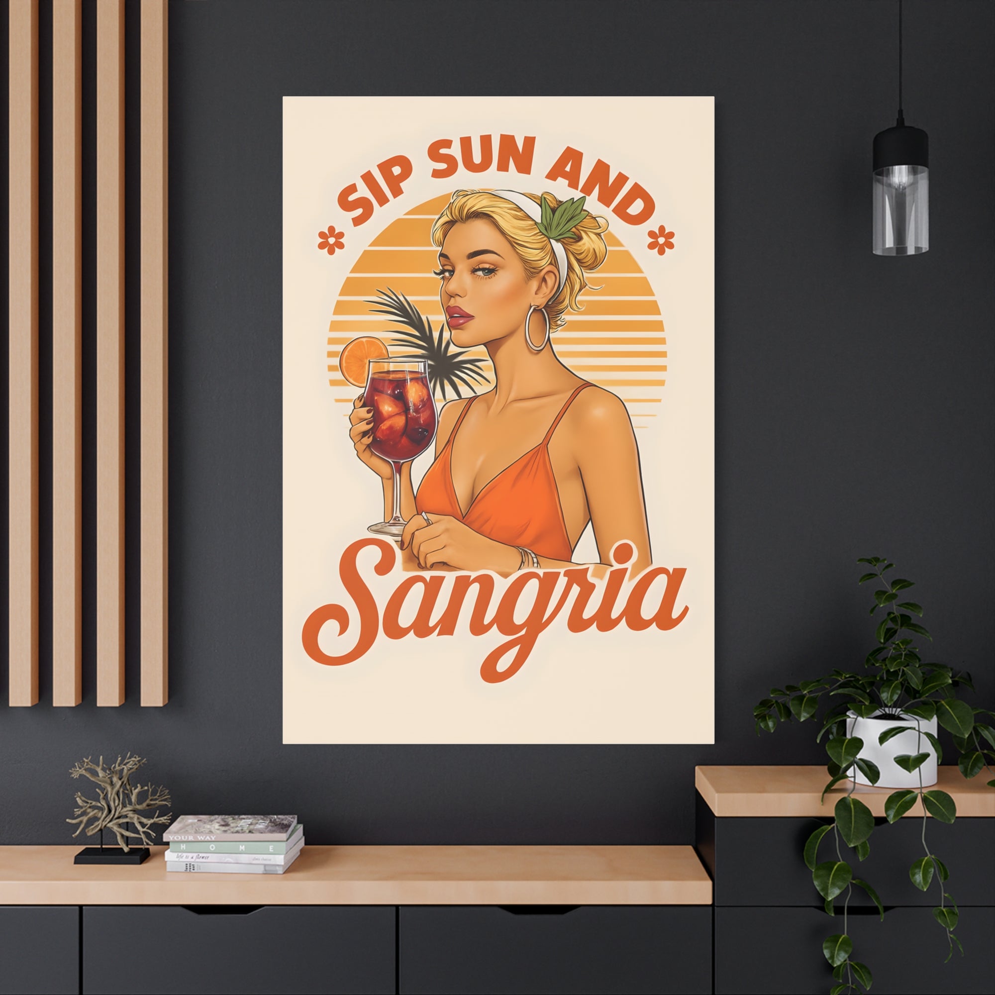 Poster of a woman holding a sangria glass with text 'Sip Sun And Sangria' on a wall.