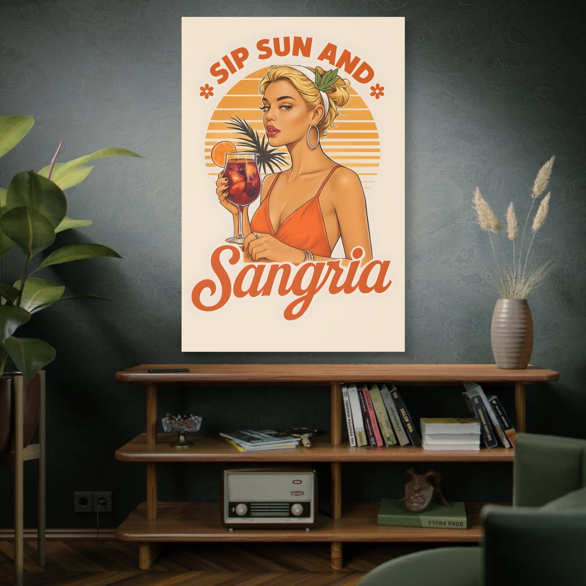 Poster with a woman holding a drink and 'Sip Sun and Sangria' text in a room with a shelf and decor.