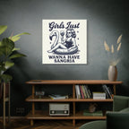 Poster with a design of a woman on an inner tube with a flamingo, text 'Girls Just Wanna Have Sangria', in a room with a shelf and decor.