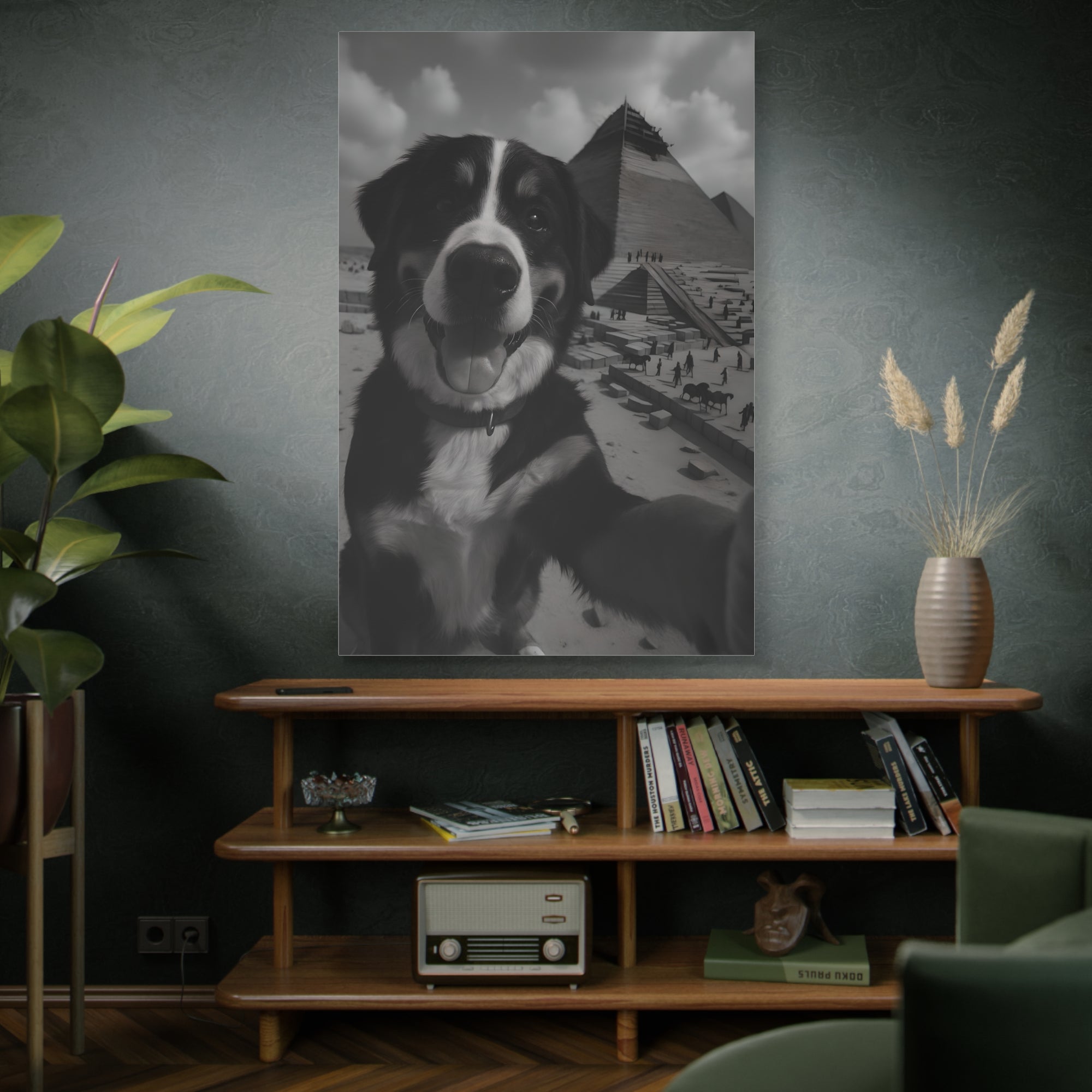 Living room with a wooden shelf, books, and a plant, featuring a framed picture of a dog on the wall.